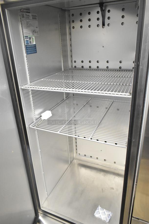 2020 True T-23F-HC stainless steel single door reach-in freezer with poly-coated racks, on commercial casters.