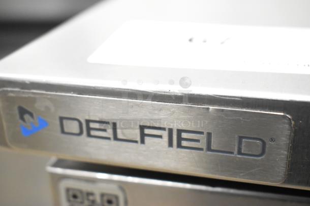 2020 Delfield 406P-STAR2 stainless steel undercounter cooler with single door, on casters, 115V, 1 phase; visible logo.