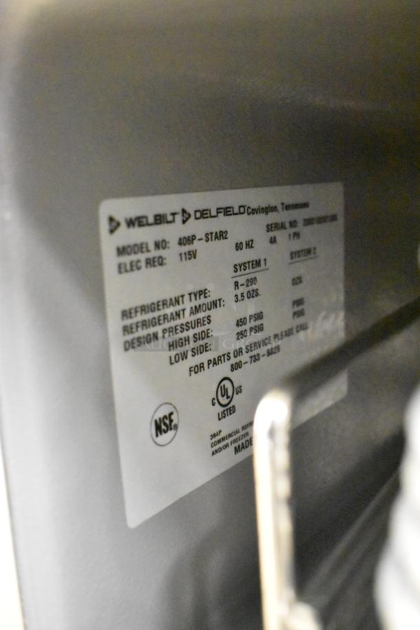 Delfield 406P-STAR2 stainless steel undercounter cooler label showing model, 115V, refrigerant details, and UL certification.