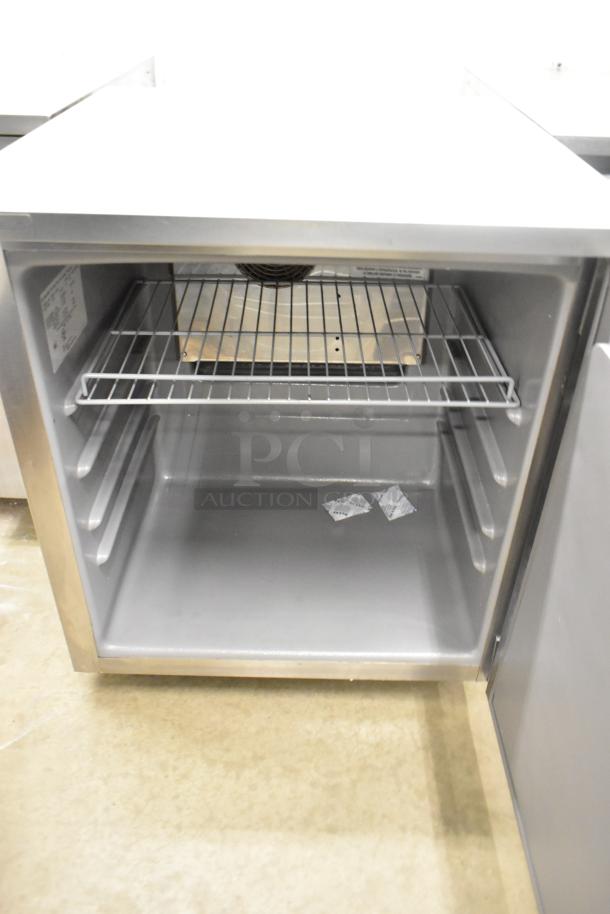 2020 Delfield 406P-STAR2 stainless steel undercounter cooler with single door, commercial casters, 115V, 1 Phase, clean interior.