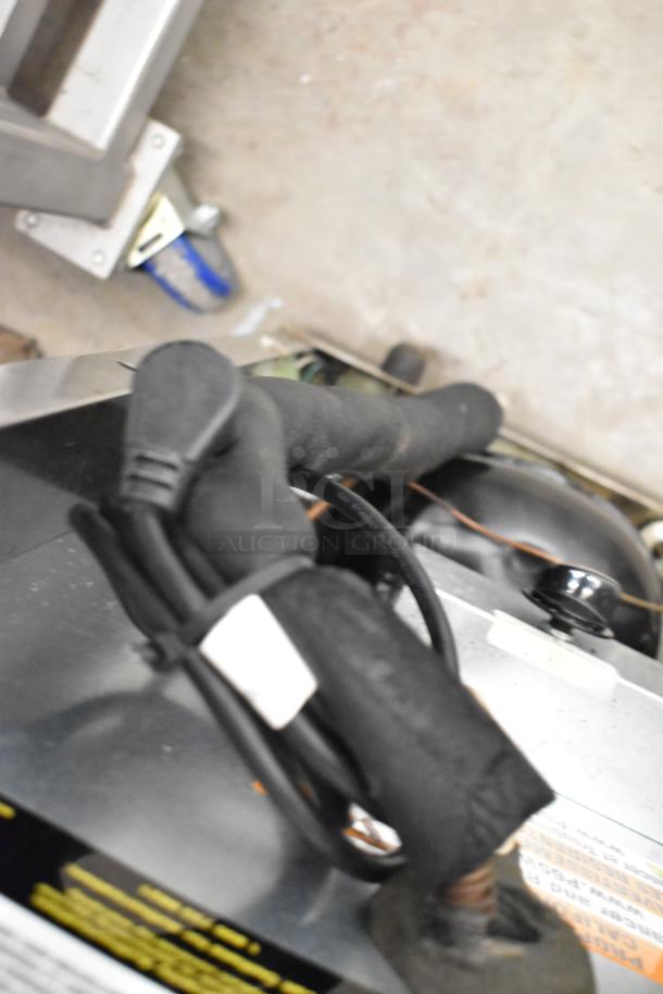 2020 Delfield 406P-STAR2 stainless steel cooler, single door, on casters. 115V, 1 Phase. Cord and components visible.