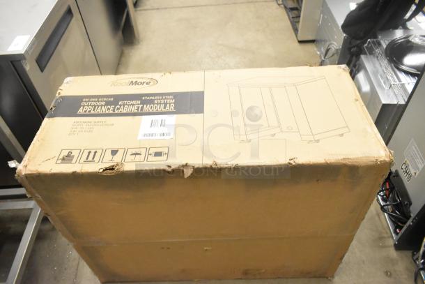 Brand new KoolMore KM-OKS-UCRCAB stainless steel 32" outdoor cabinet kitchen for refrigerator, in original packaging with visible box wear.