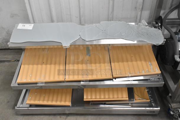 KoolMore stainless steel 2-tier display case, brand new, broken glass top, orange shelving, visible scratch and dent.