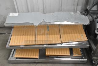 KoolMore stainless steel 2-tier display case, brand new, broken glass top, orange shelving, visible scratch and dent.