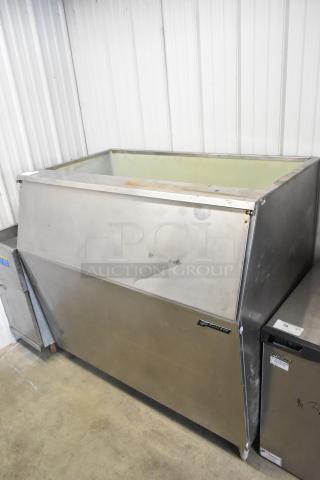 Follett Metal Commercial Ice Bin, stainless steel, large capacity, visible wear, Follett branding on front, industrial use.