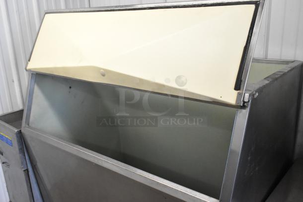 Follett Metal Commercial Ice Bin with hinged lid, showing spacious interior. Appears in good used condition, ideal for businesses.