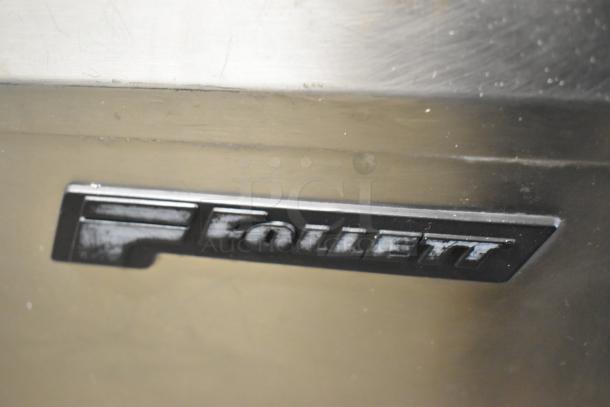 Follett metal commercial ice bin with visible logo, in used condition. Durable construction suitable for business use.