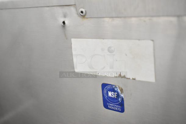 Follett Metal Commercial Ice Bin with visible NSF sticker, indicating approved sanitary standards. Surface shows minor wear.