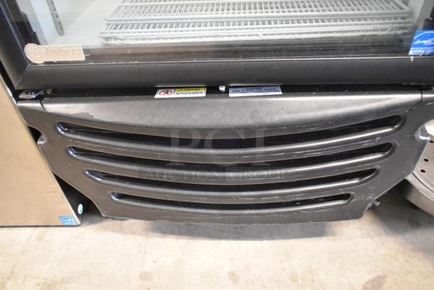 Imbera G319 metal commercial cooler with single glass door, poly-coated racks, and commercial casters. Visible Imbera logo.