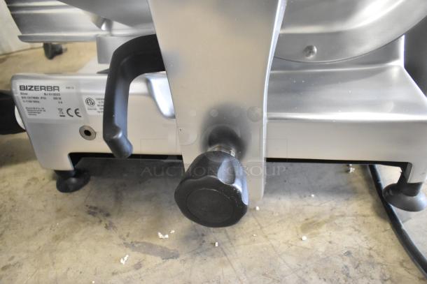 2023 Bizerba GSE 12 metal commercial meat slicer, 110V, 1 phase. Features durable construction. Model label visible.