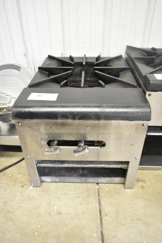 Stainless steel commercial countertop gas burner for stock pots, features sturdy grates, dual controls; good condition.