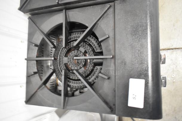 Stainless steel commercial countertop single burner gas range, robust black grate. Appears in good condition, ideal for stock pots.