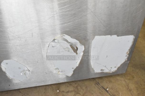 Cook Rite stainless steel single burner stock pot range with visible surface scratches and paint chipping, commercial-grade.