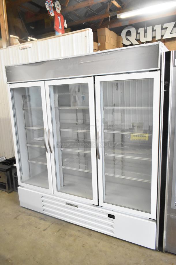 Beverage Air 3-door commercial cooler, glass doors, poly-coated racks, good condition, ideal for merchandising.