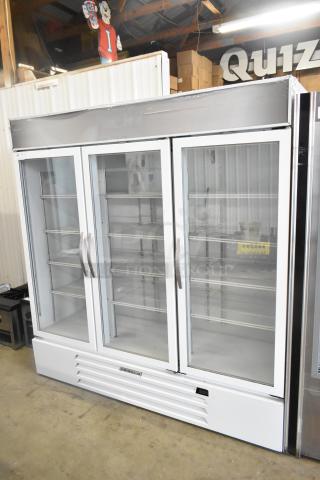 Beverage Air 3-door commercial cooler, glass doors, poly-coated racks, good condition, ideal for merchandising.