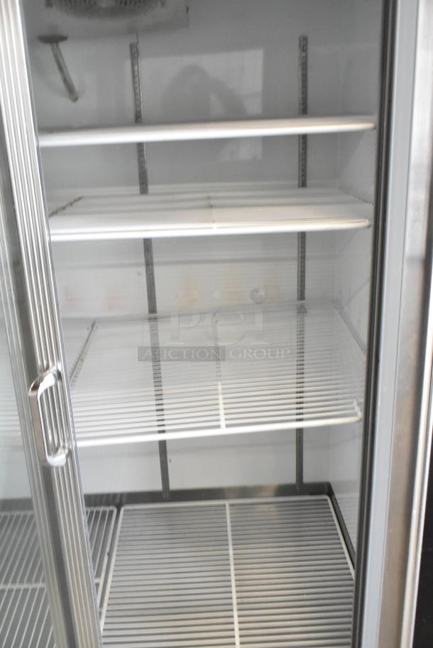 Dial metal commercial 2-door reach-in cooler, poly-coated racks, 115 volts, 1 phase, excellent condition.