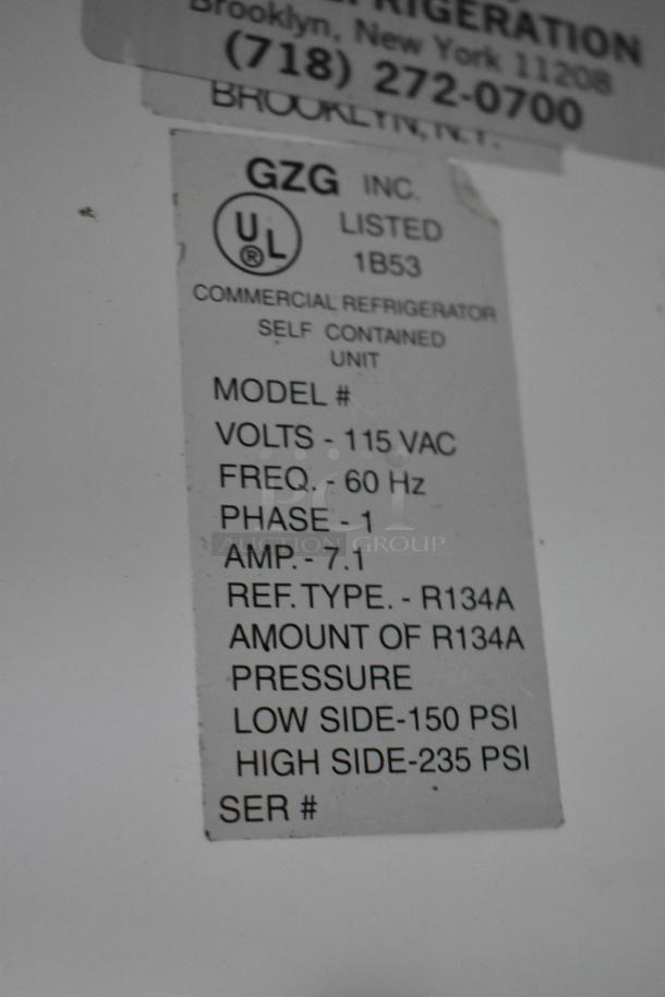 Dial Metal Commercial 2 Door Reach In Cooler Merchandiser, 115V, 1 Phase, UL listed, with poly-coated racks.