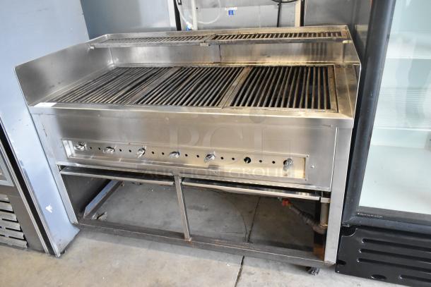 Stainless steel commercial gas grill with multiple burners, on durable casters. Featuring control knobs. Good condition.