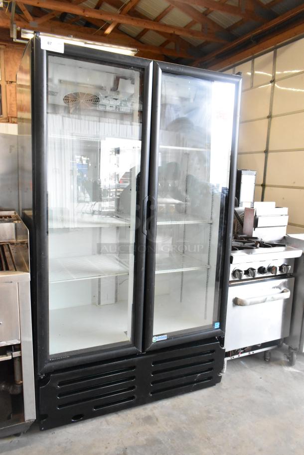 Imbera VRD37 two-door reach-in cooler merchandiser, 115 volts, 1 phase, with poly-coated racks in good condition.