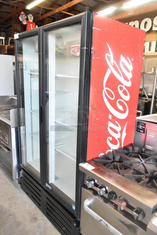 Imbera VRD37 2-door cooler merchandiser, metal frame, poly-coated racks, Coca-Cola branding, 115V, 1 phase, used condition.