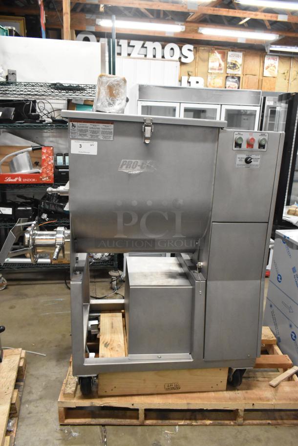 Brand new 2025 Pro-Cut KMG-32 metal commercial meat grinder on casters, 220V, 3-phase. Visible Pro-Cut logo and control buttons.