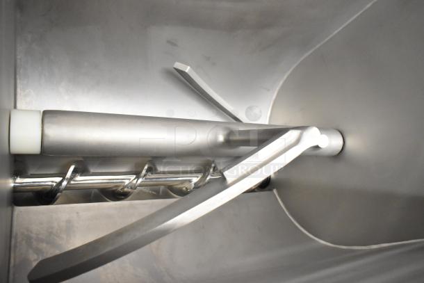 Pro-Cut KMG-32 meat grinder interior view, showing stainless steel auger and blades. New, scratch and dent. 220V, 3-phase.