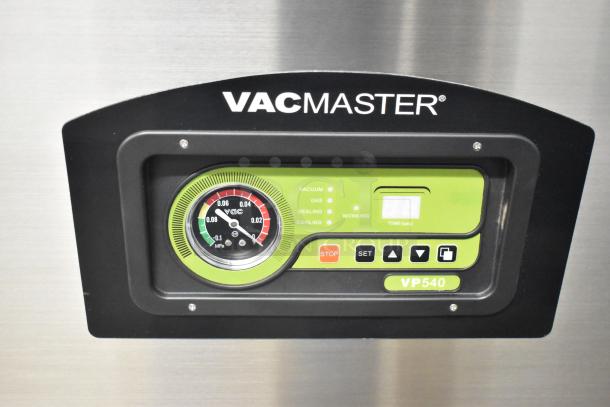 VacMaster VP540 control panel, featuring a gauge, digital display, and function buttons on a stainless steel vacuum sealer.