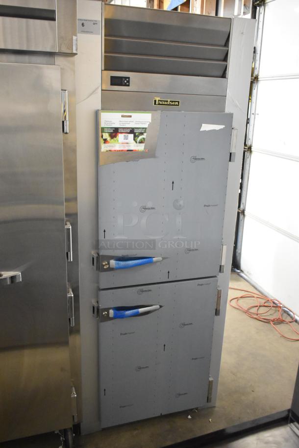 Traulsen G10042-032 stainless steel reach-in cooler, 2 half doors, poly-coated racks, 115V, brand new with minor scratches.