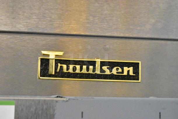 Traulsen logo on stainless steel surface of commercial cooler model G10042-032. Brand new, minor cosmetic damage.