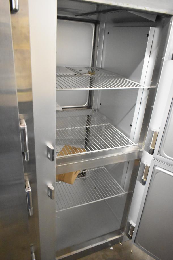 Traulsen G10042-032 stainless steel reach-in cooler with two half-size doors, poly-coated racks, and minor scratches.