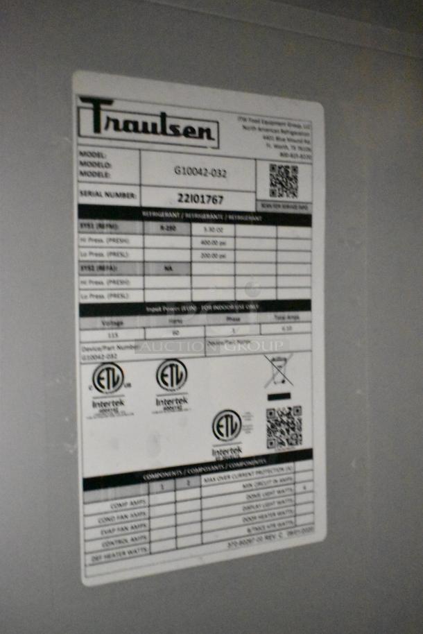 Label on Traulsen G10042-032 stainless steel cooler, detailing model, serial number 22101767, and specifications.