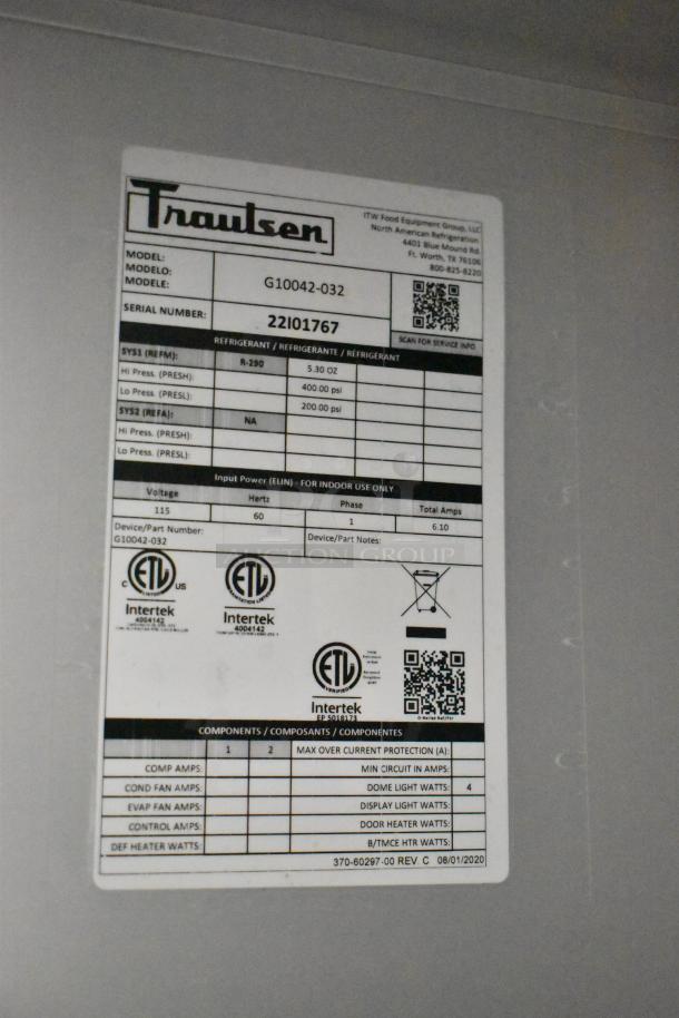 Label on Traulsen G10042-032 cooler showing model, serial number 22101767, voltage 115, phase 1, and ETL certifications.
