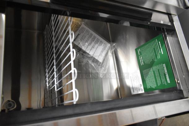 BRAND NEW 2023 Atosa MBC50GR Stainless Steel Bottle Cooler with 2 Sliding Lids, Commercial Casters; 115V, 1 Phase. Visible tags inside.