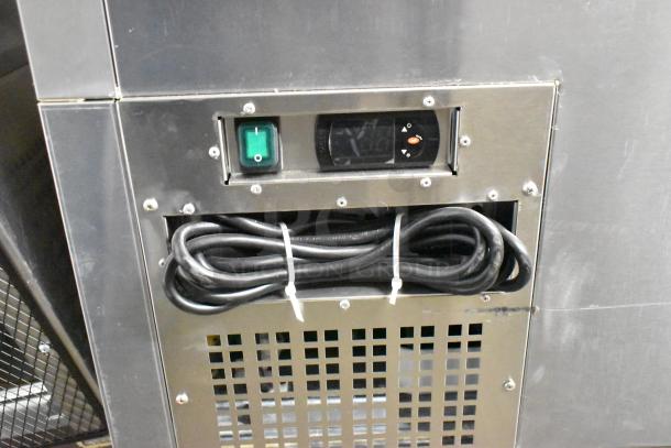 Brand new 2023 Atosa MBC50GR stainless steel cooler, featuring a control panel and cord storage, with minor scratches.