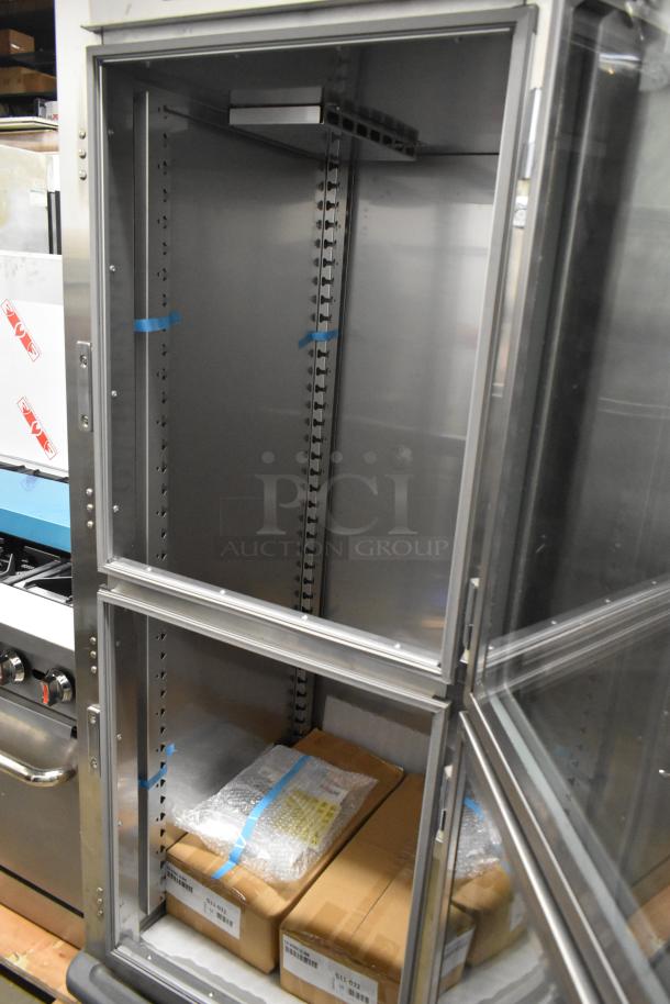 Brand new Metro C599-SDC-U C5 stainless steel holding/proofing cabinet with clear Dutch doors, on commercial casters.