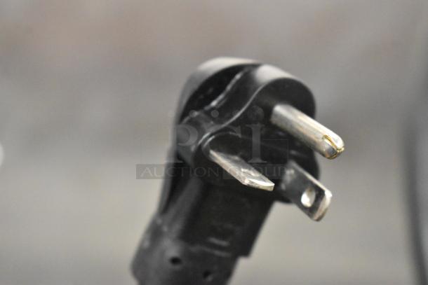 Close-up of a three-prong plug for the Metro C599-SDC-U commercial holding/proofing cabinet, 2022 model.