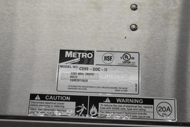 BRAND NEW Metro C599-SDC-U stainless steel holding/proofing cabinet with clear Dutch doors, label shows certification and specs.