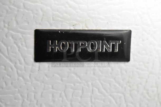 Hotpoint HTR16BBSARWW metal reach-in cooler with freezer. Features embossed Hotpoint logo. 115 volts, 1 phase.