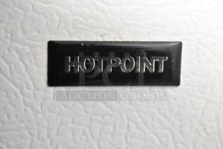 Hotpoint HTR16BBSARWW metal reach-in cooler with freezer. Features embossed Hotpoint logo. 115 volts, 1 phase.