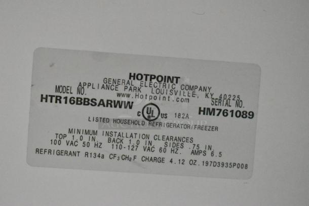 Hotpoint HTR16BBSARWW cooler label, lists serial number HM761089, 115V, 1-phase, R134a refrigerant info, and clearances.