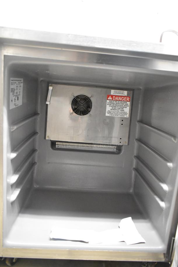 2023 Delfield 406P-STAR2 stainless steel single door undercounter cooler. Interior fan, warning label visible, on casters.