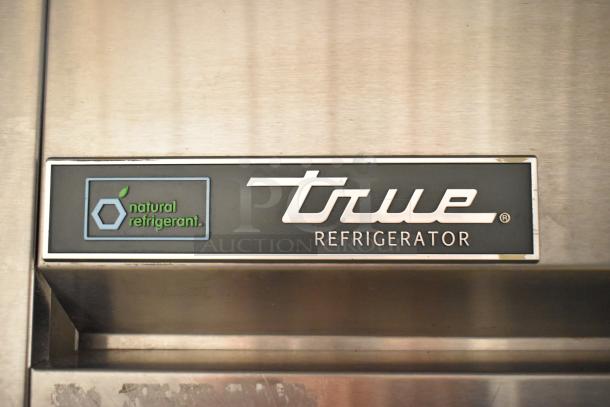 True TG2R-2S-HC stainless steel reach-in cooler label, highlighting natural refrigerant. Model features durable construction.