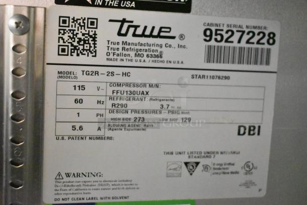 Label on 2018 True TG2R-2S-HC cooler; 115V, 1 phase, R290 refrigerant, serial 9527228, compressor FFU130UAX. Made in USA.