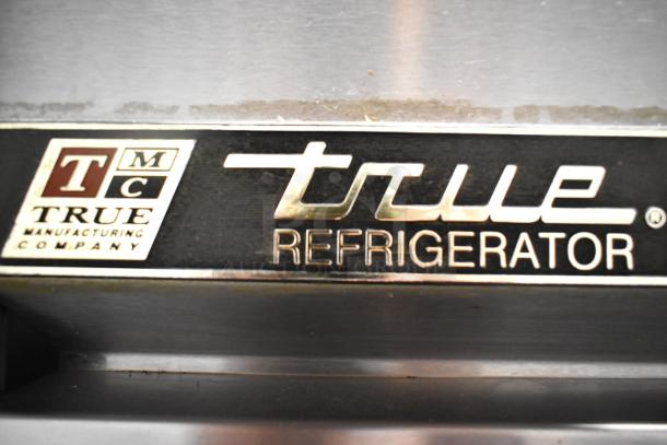 True T-35 stainless steel commercial 2-door cooler with poly-coated racks, 115 volts, 1 phase. True Manufacturing label.