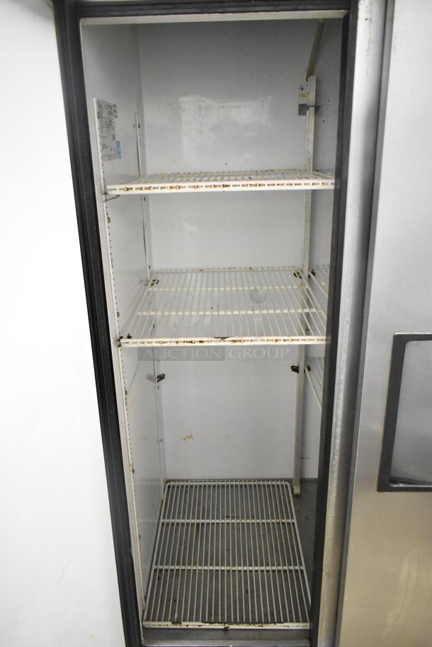 True T-35 stainless steel commercial 2-door reach-in cooler with poly-coated racks, 115 volts, 1 phase, used condition.
