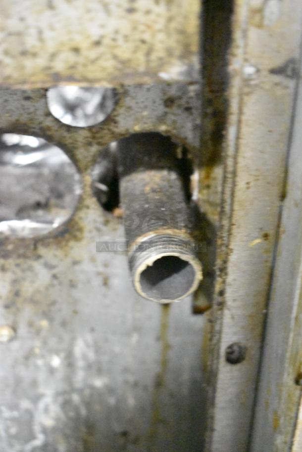 Garland Stainless Steel 6 Burner Range connector showing signs of wear. Gas-powered, commercial use. Condition details noted.