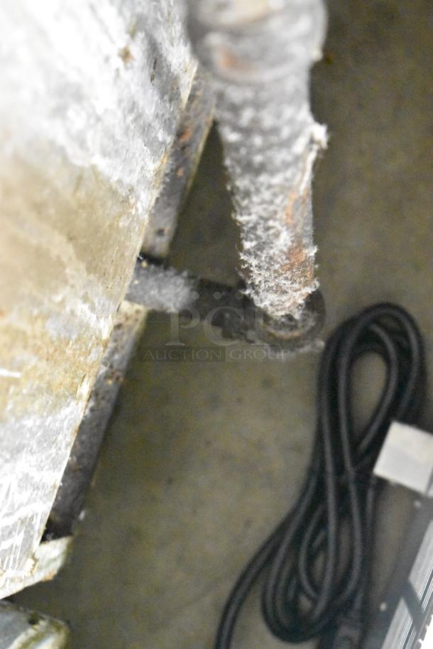 Dean SR42GN stainless steel commercial deep fat fryer, natural gas powered, 105,000 BTU, showing wear and rust on pipes.