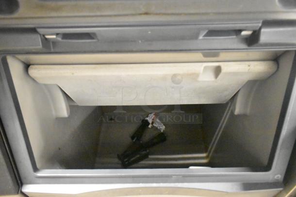 Manitowoc ID0503W-161 stainless steel commercial ice head on bin, 115V, 1 phase, open bin view, clean interior.