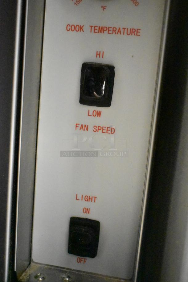 Cooking Performance Group convection oven control panel showing temperature, fan speed options, and light switch.