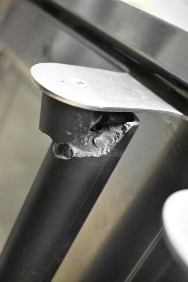 Damaged corner of Cooking Performance Group 351FGC100DDN stainless steel convection oven, showing wear to the frame.